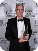 Photo of CDSE instructor Patrick Ganley receiving the Chief Learning Officer Learninglite Award for CDSE